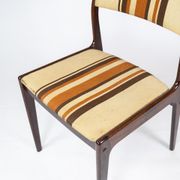 Pair of chairs in dark wood upholstered with light striped fabric of danish design