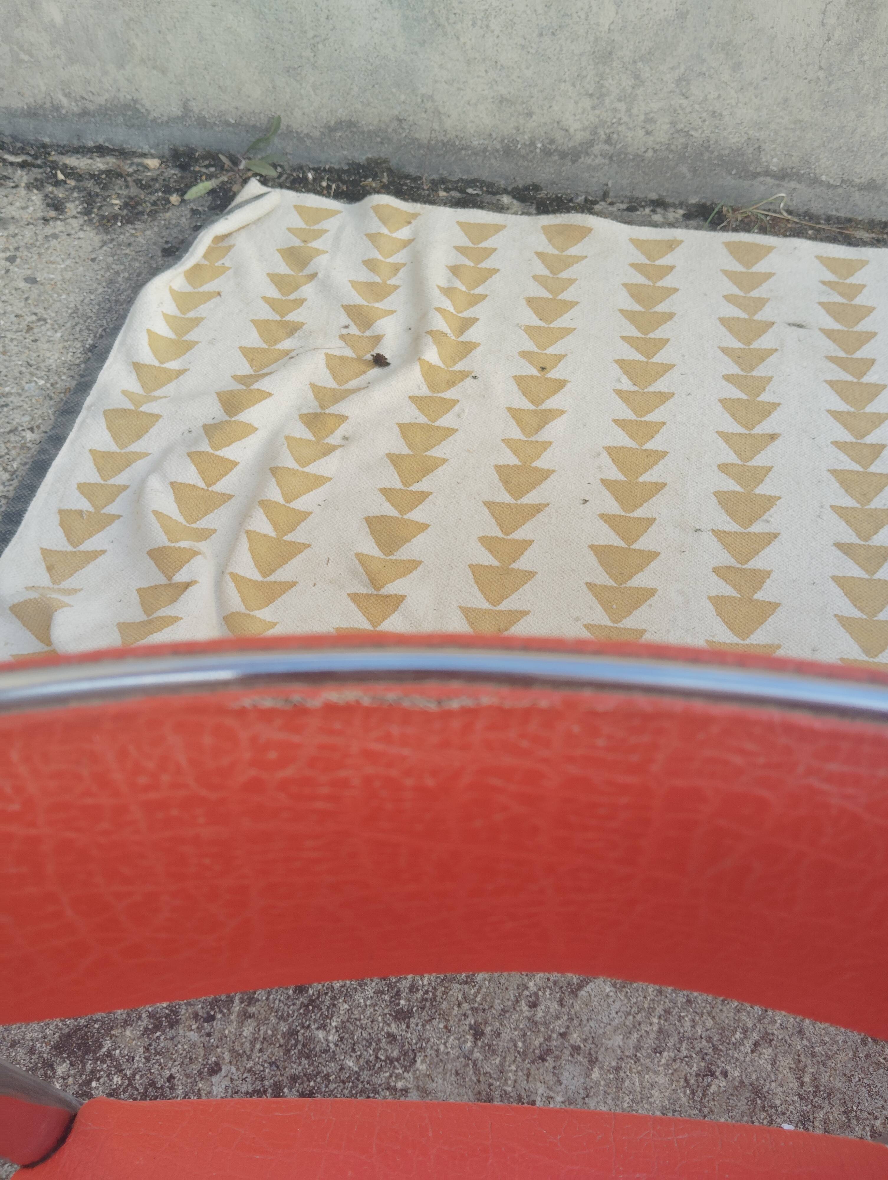 Set of 4 vintage chrome and orange faux leather chairs.