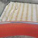 Set of 4 vintage chrome and orange faux leather chairs.