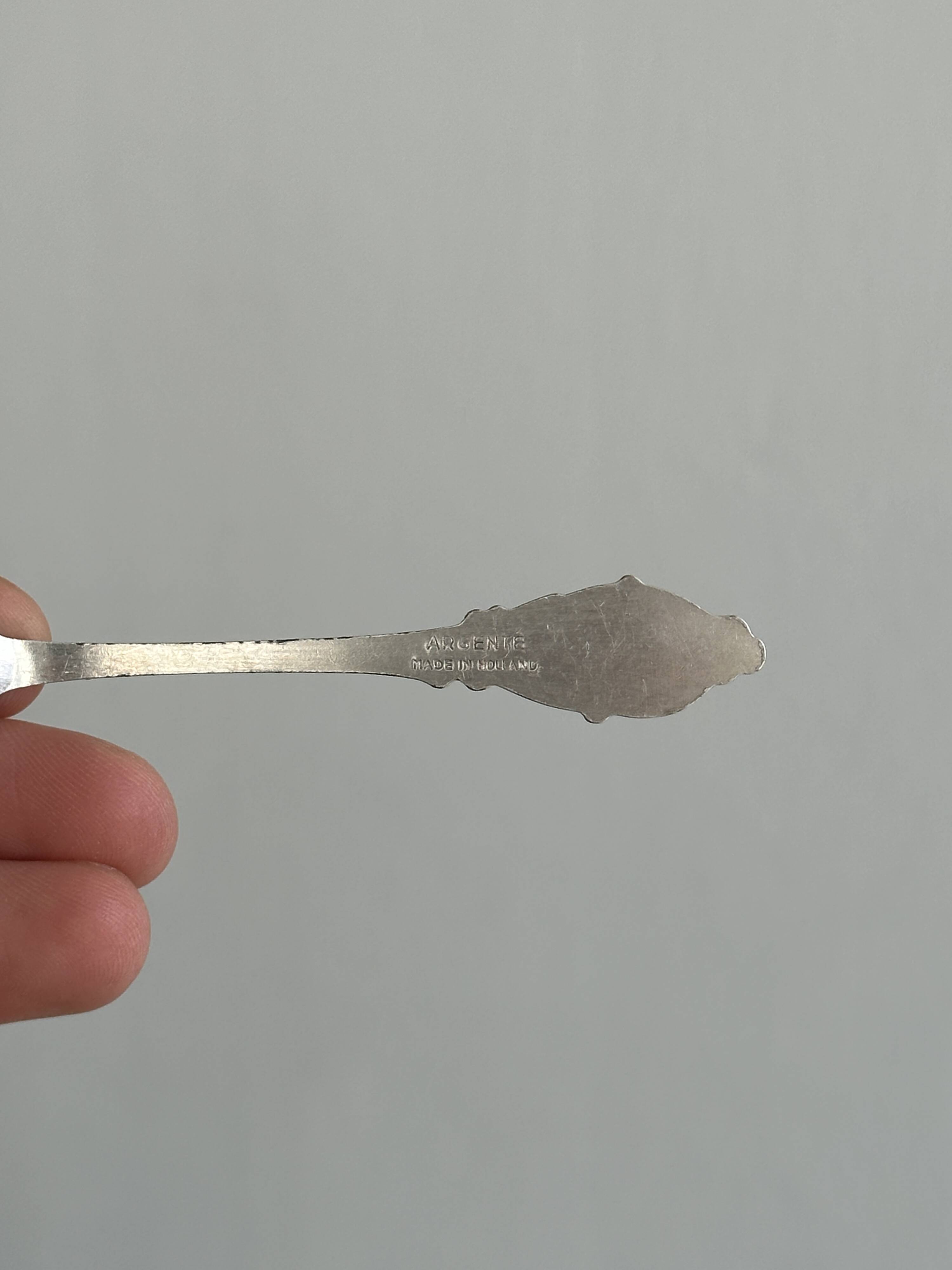 Two small metal spoons