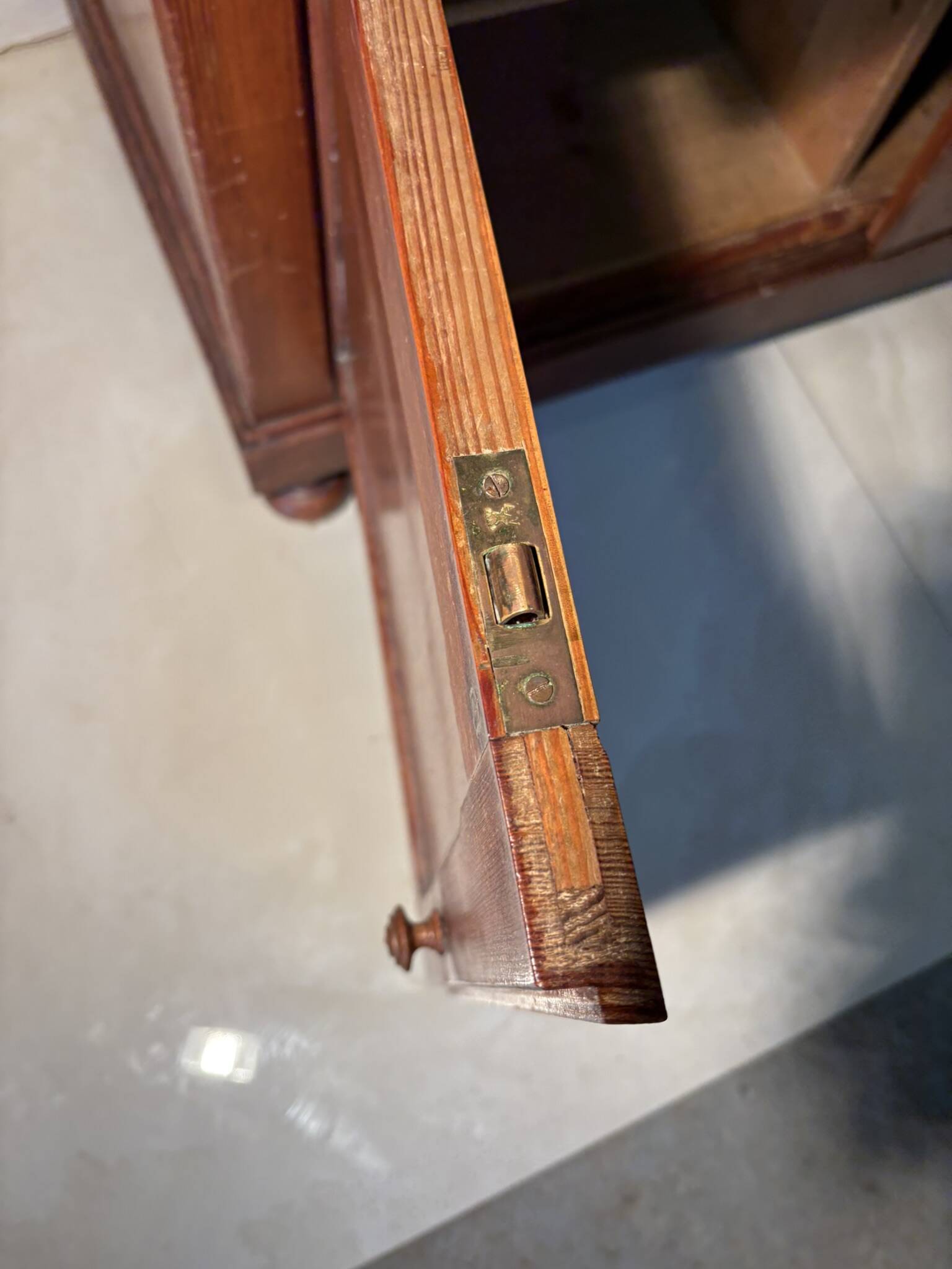 Antique wood and marble kitchen sideboard with carved backsplash