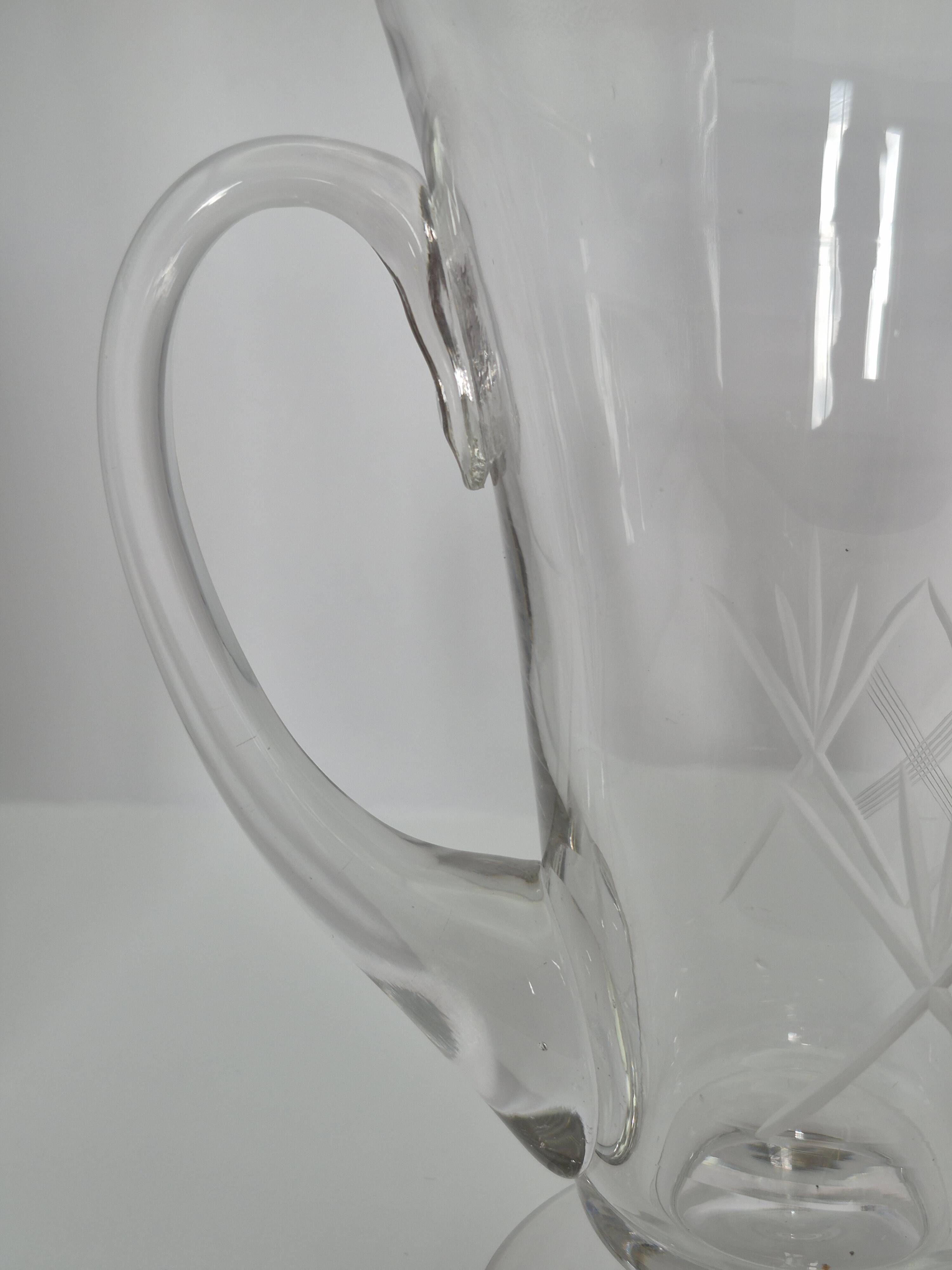 Crystal service from Fains, matching wine carafe and water jug.