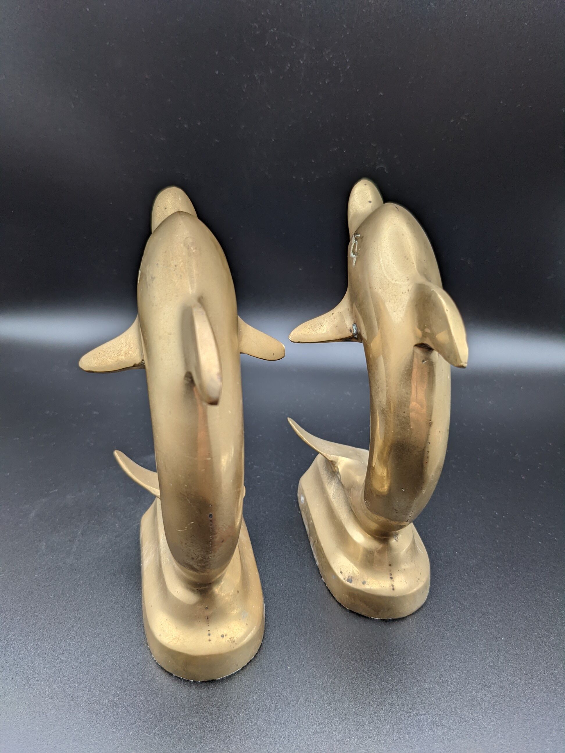 Pair of brass dolphins bookends