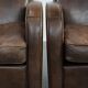Elegant set of two sheepskin leather armchairs with beautiful round shapes