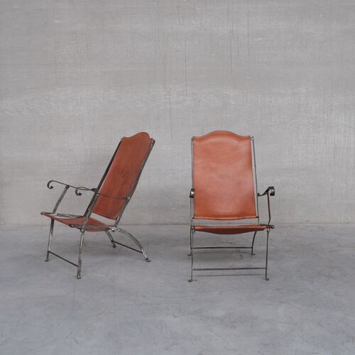 Pair of mid-century leather and metal folding armchairs