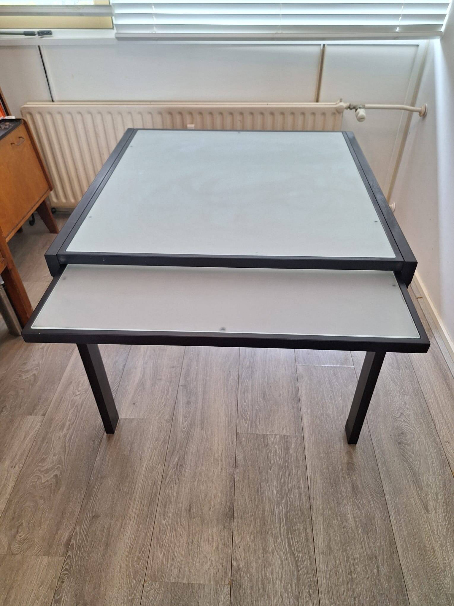 Italian metal table with frosted glass top, extendable.