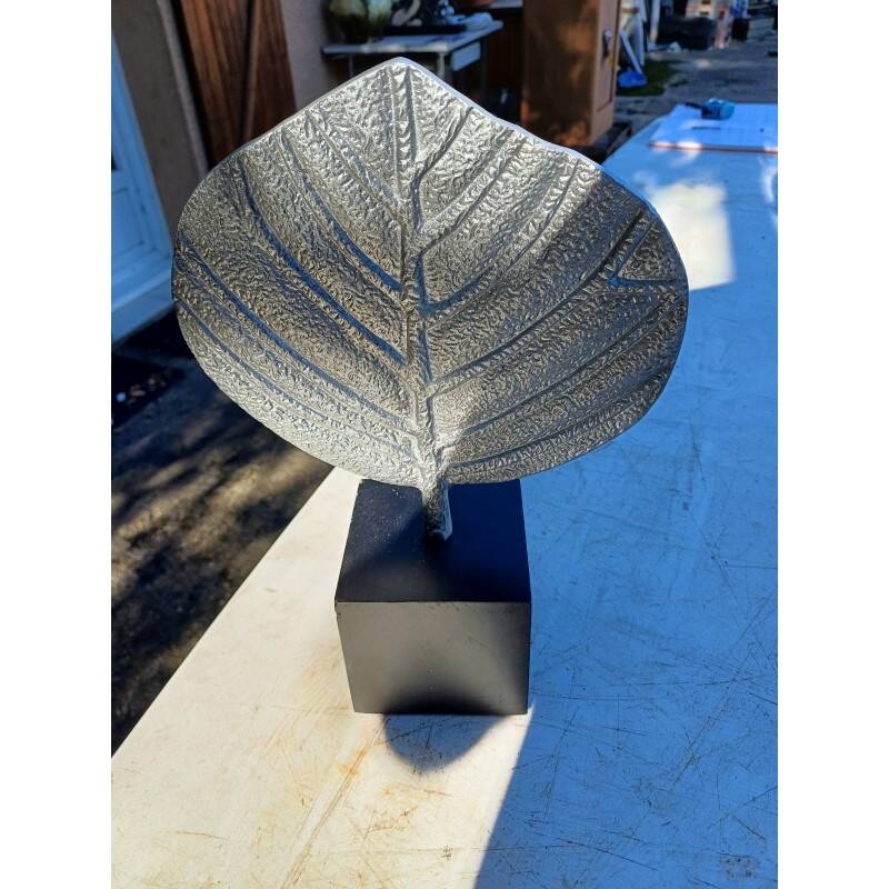 Vintage aluminum leaf decoration on wooden base