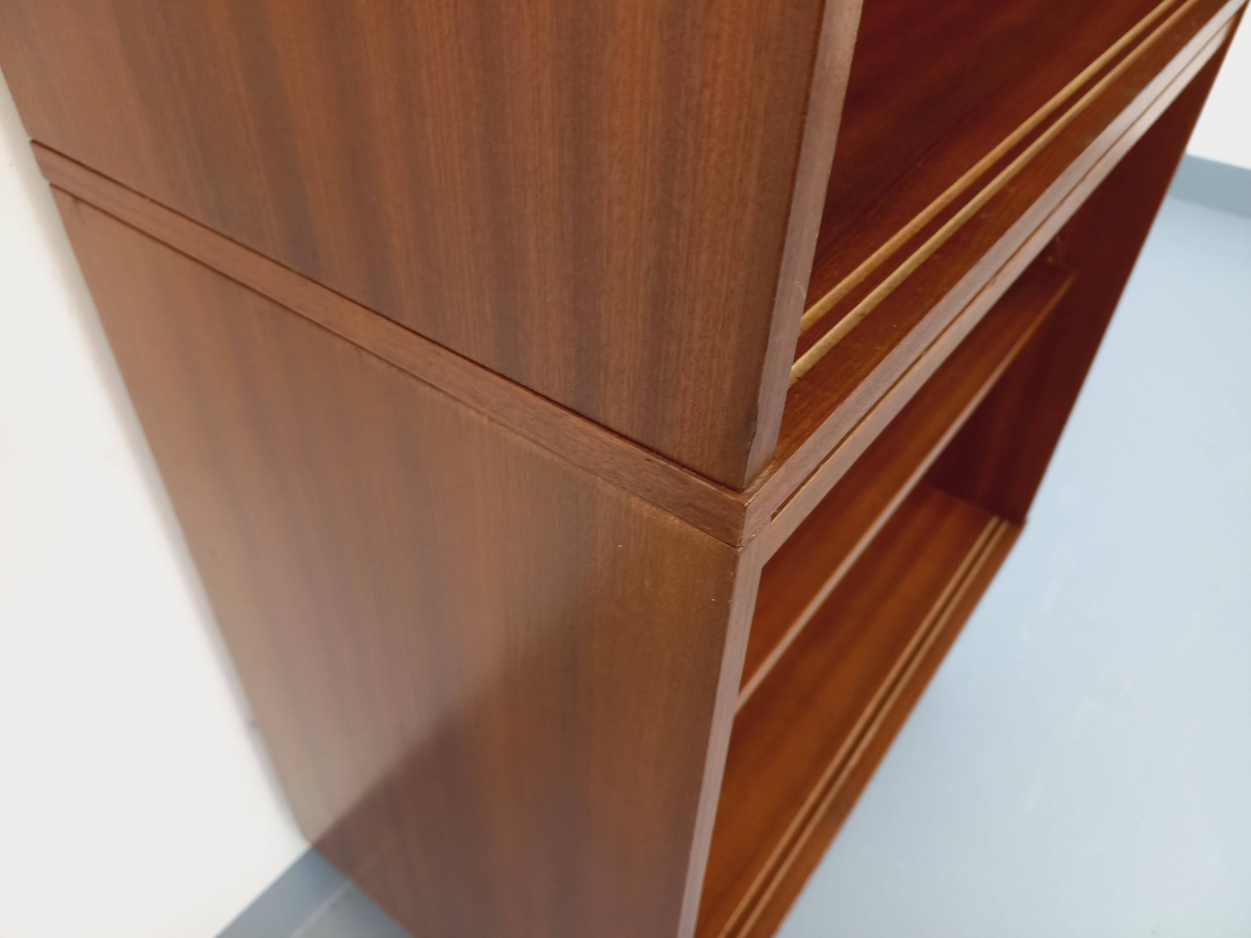 Vintage wooden bookshelf in teak style from the 1960s.
