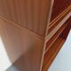 Vintage wooden bookshelf in teak style from the 1960s.