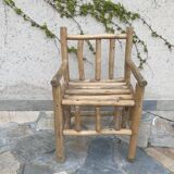 Art-Populaire armchair in raw wood, circa 1950.