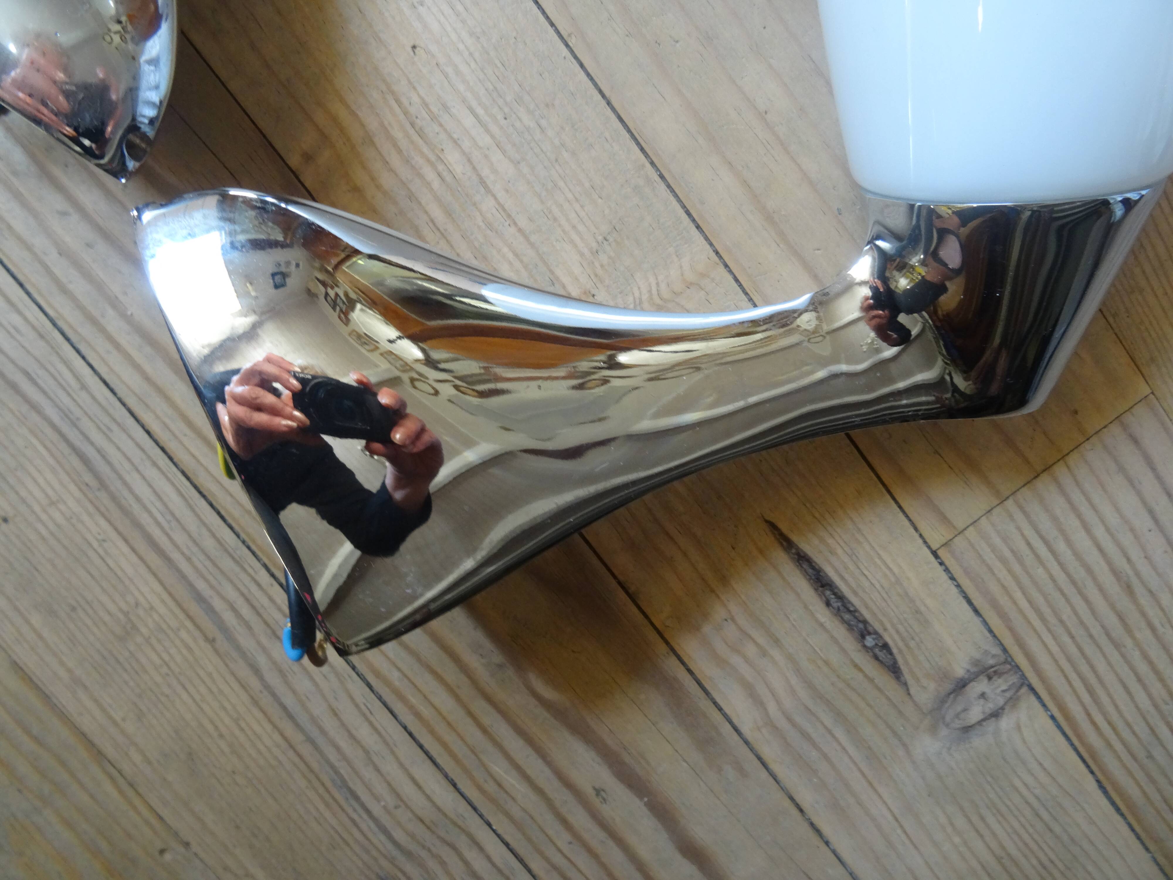 Pair of stainless steel and opaline wall lamps