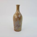 Brown ceramic/stoneware bottle with chiseled floral pattern