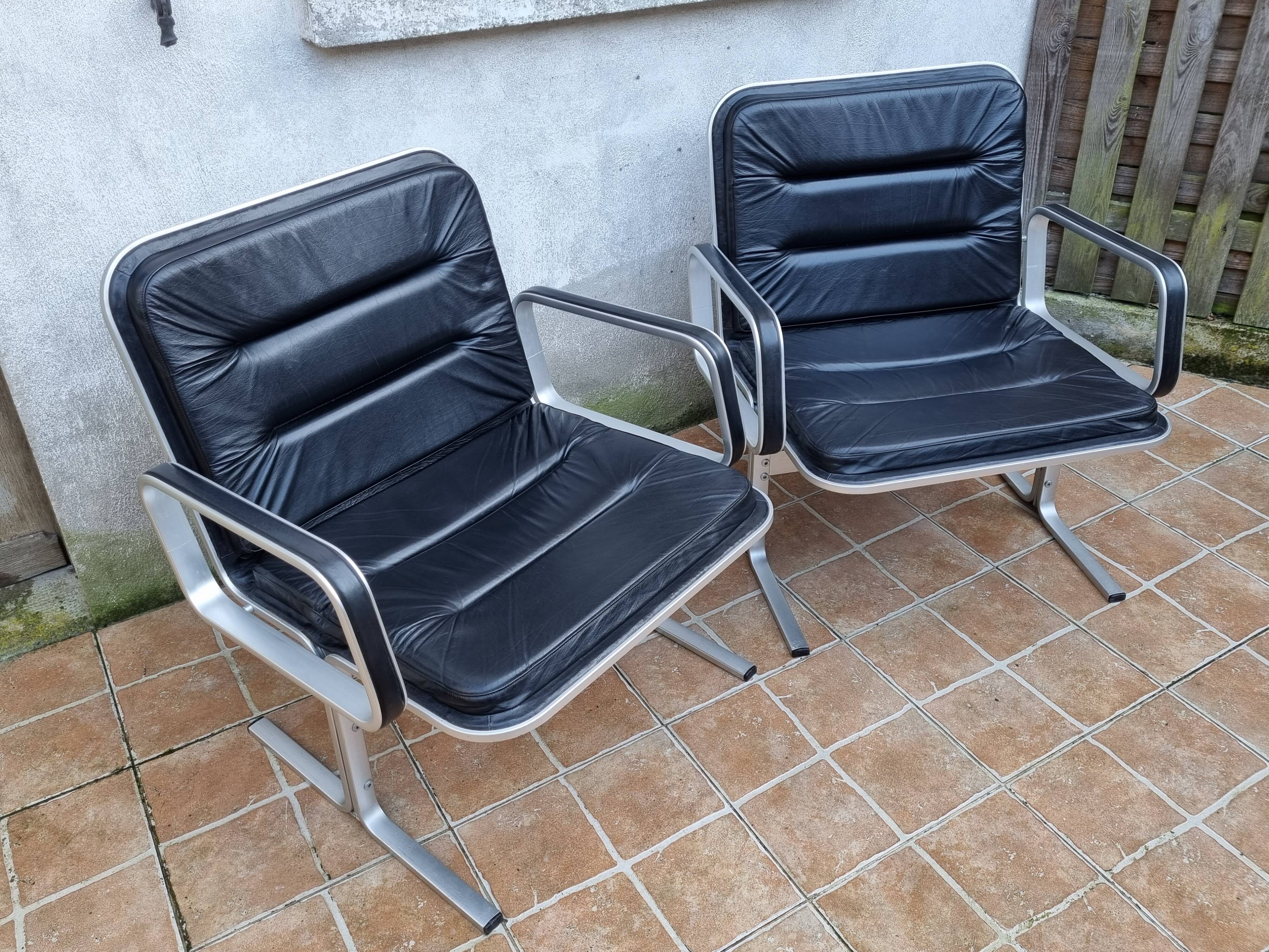 Pair of vintage leather and aluminum armchairs, restored