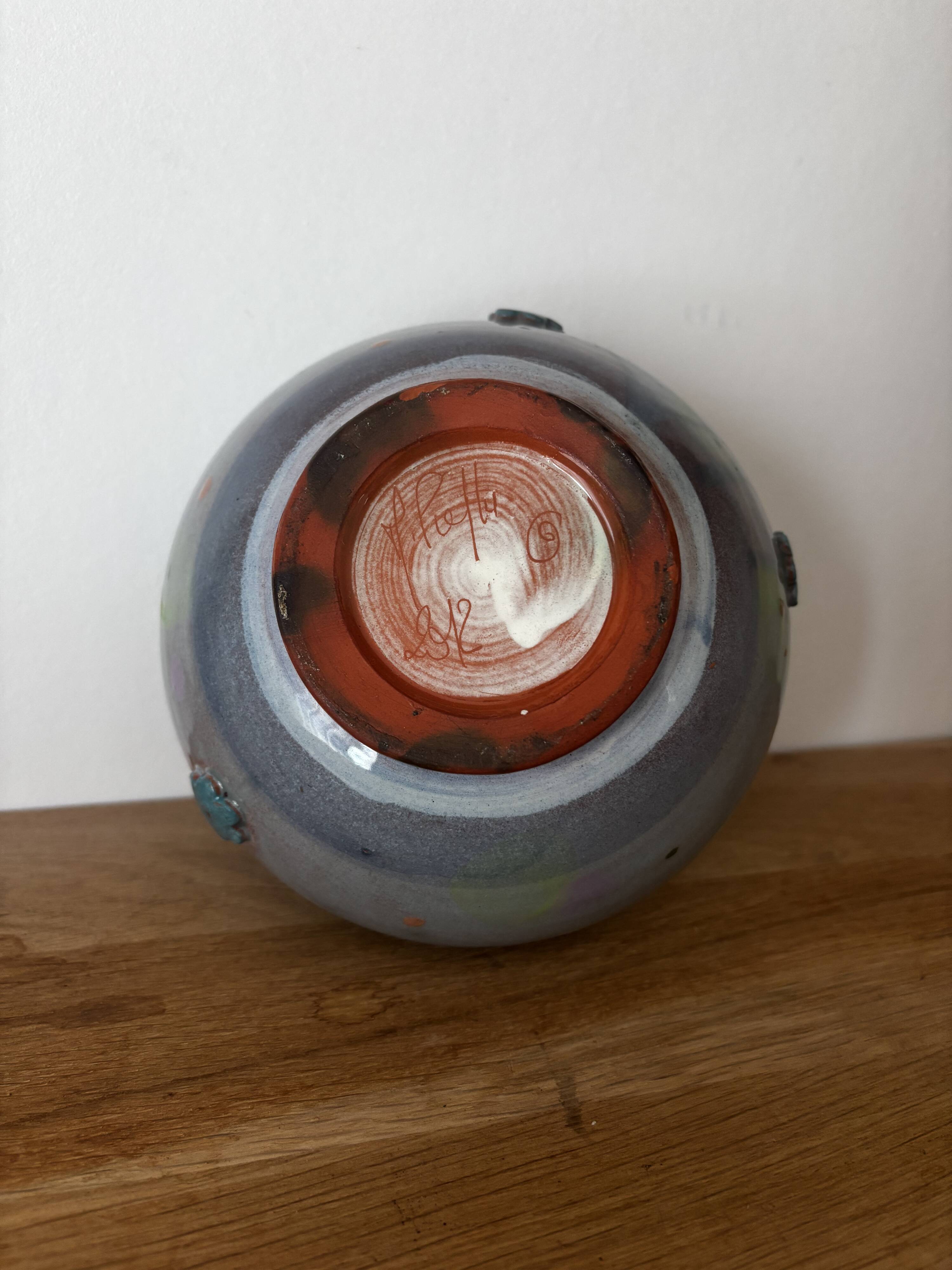 Magnificent pot or vase, handcrafted pottery with flowers, signed on the back.