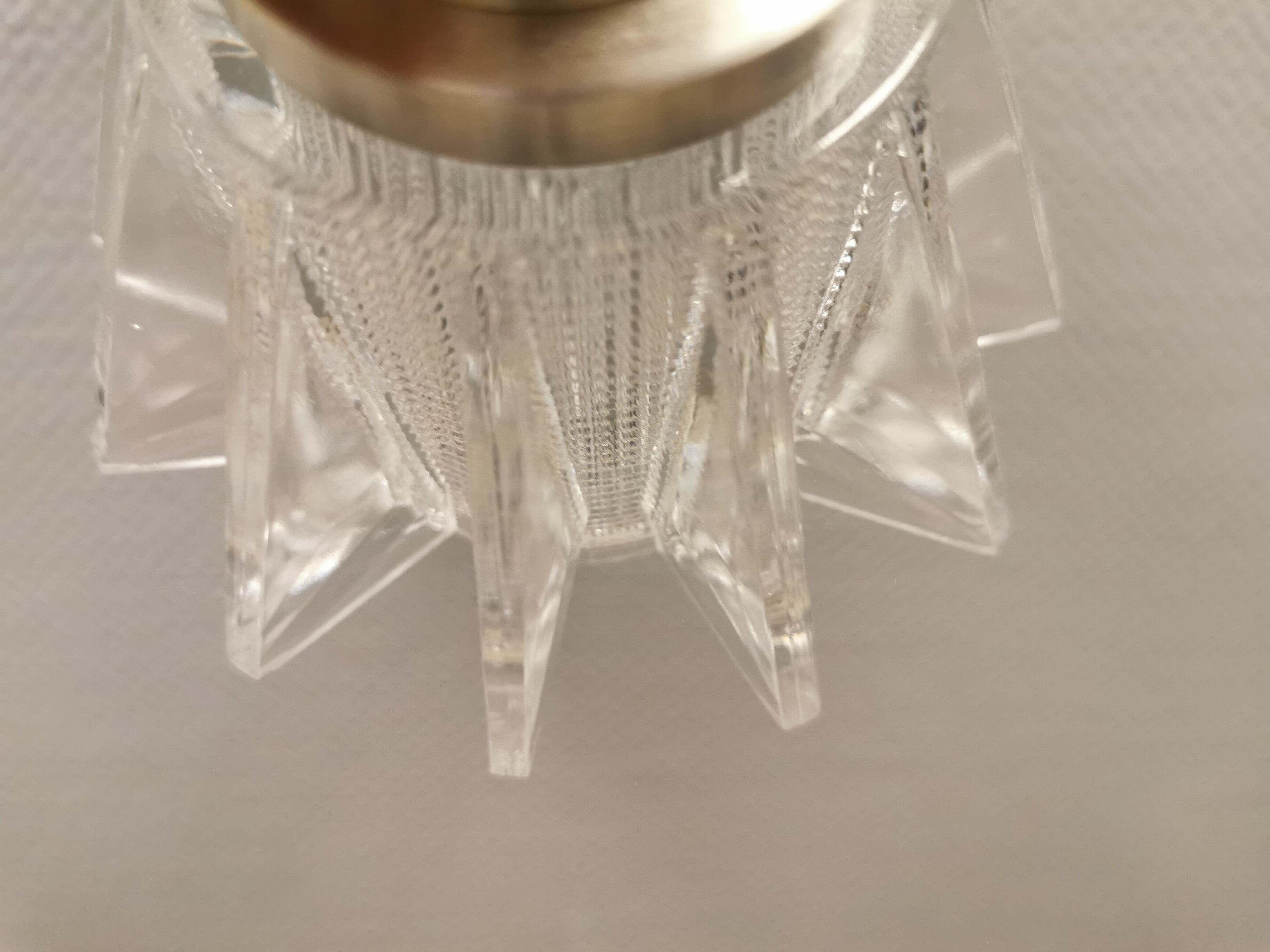 A set of smaller hanging lamps, in hard pressed glass, with metal top