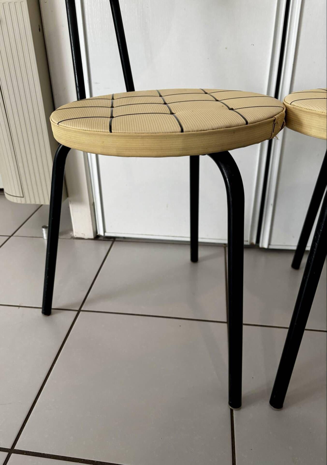 Pair of vintage retro mustard yellow chairs with black metal.