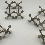 Set of 7 vintage knife rests in the shape of crosses in silver-plated metal.