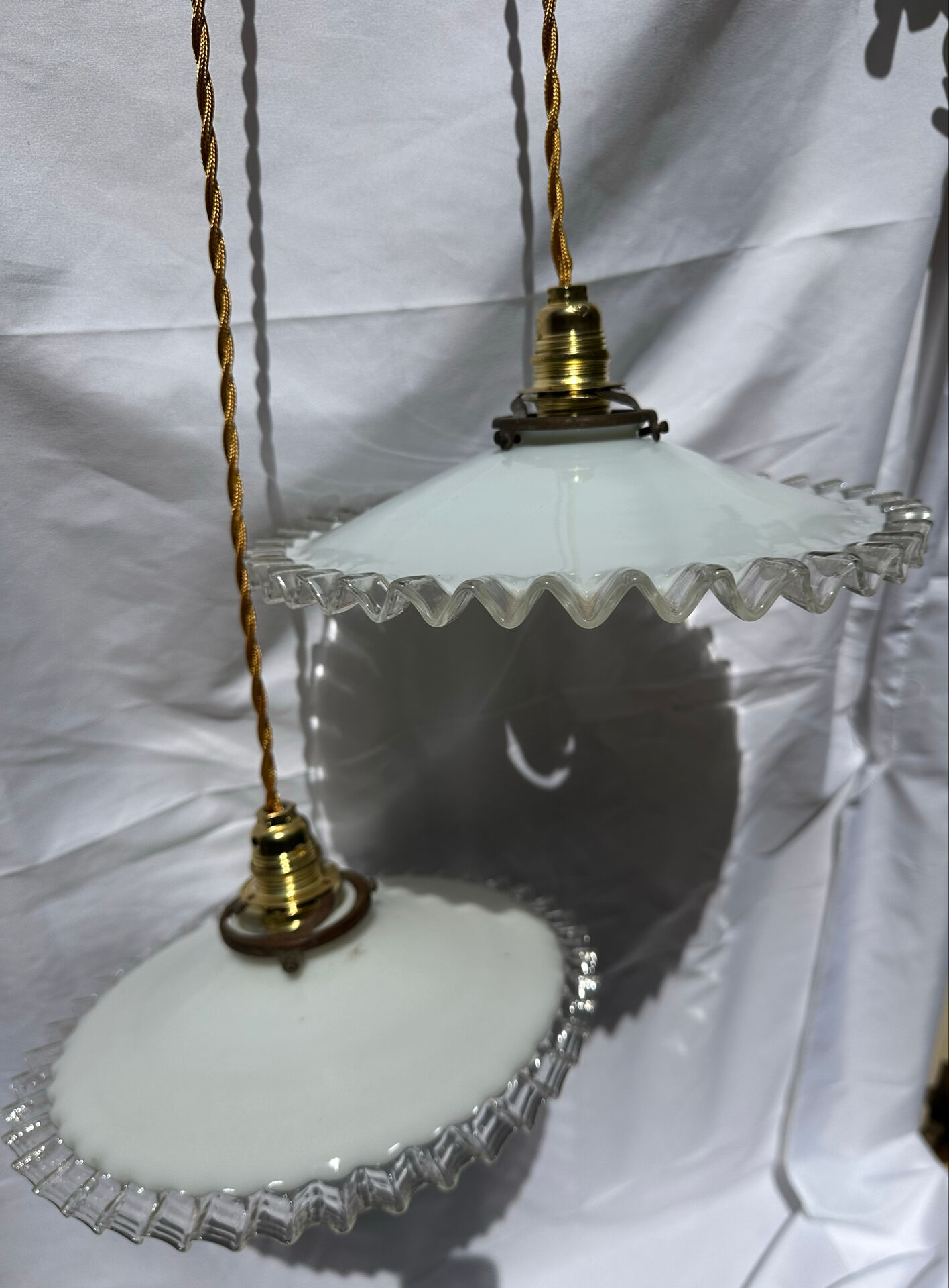 Vintage wavy opaline suspension pair with brass claw