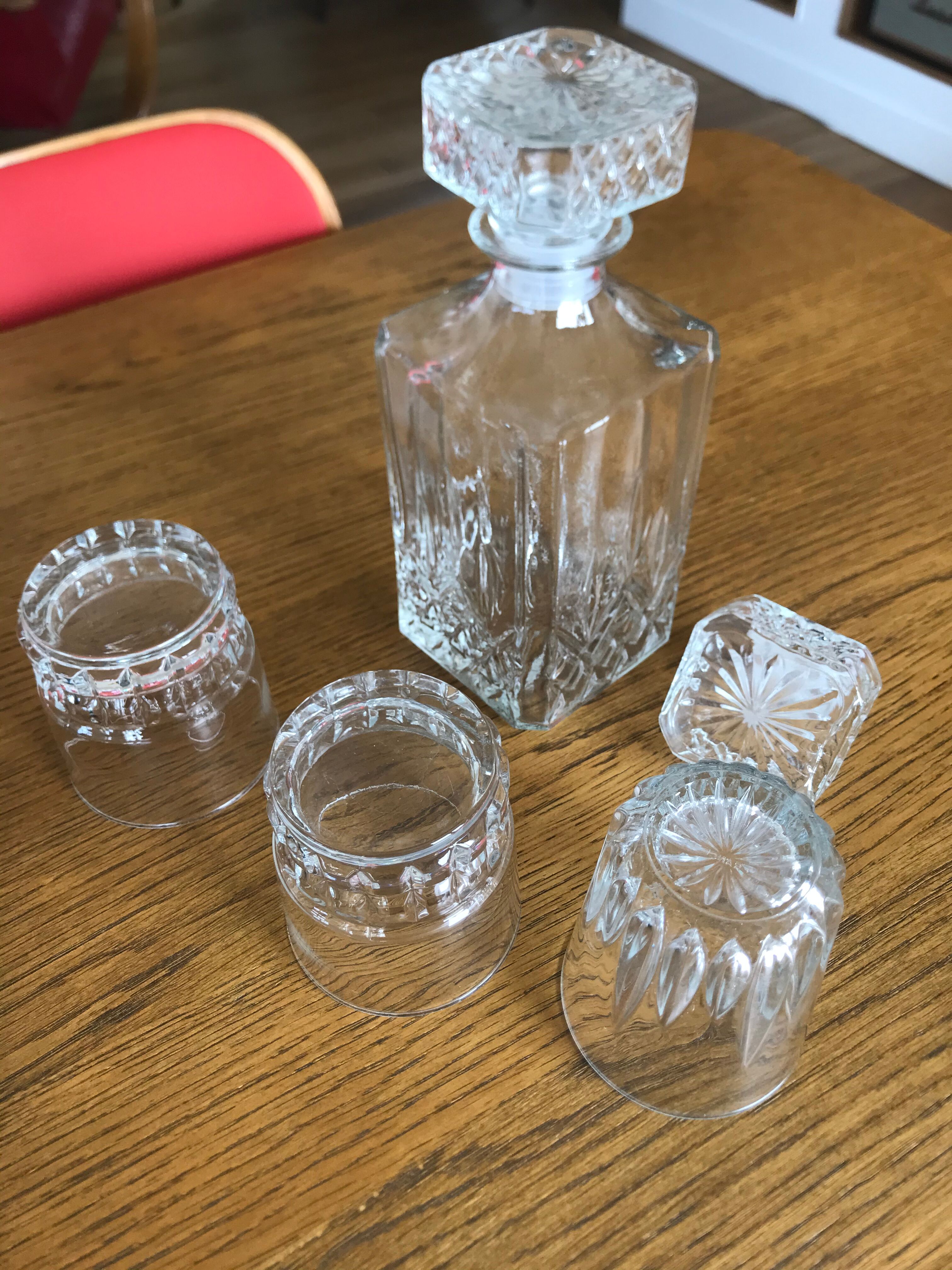 Mismatched decanter and whiskey glasses