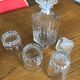Mismatched decanter and whiskey glasses