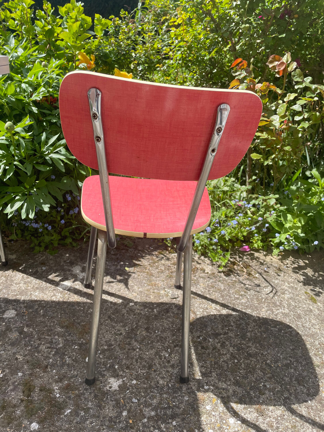 Formica table with a red Mid-century chair.