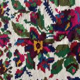 White vintage floral rug made by hand in Romania, beautiful flowers