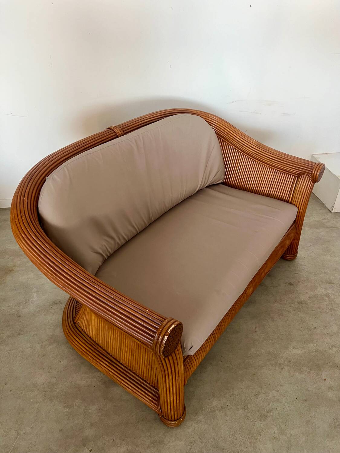 Old 2-seater rattan sofa Italian design from the 70s vintage