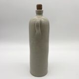 Old hot water bottle in glazed stoneware, gray color.