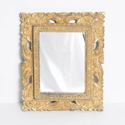 Decorative gold mirror mid-century in a wooden frame, Italy, 1960s.