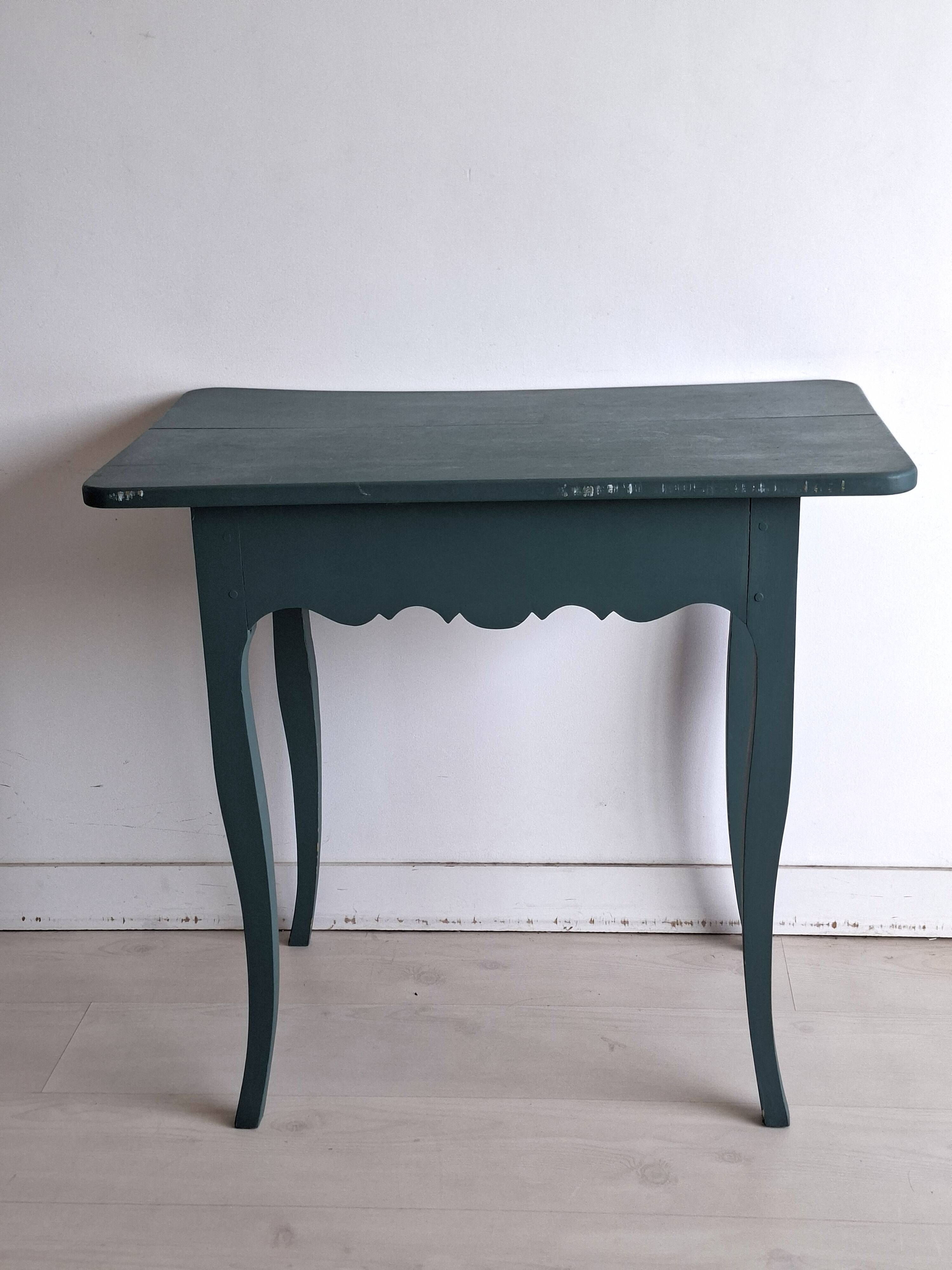 Antique Gustavian-style table painted in dark green with a drawer.