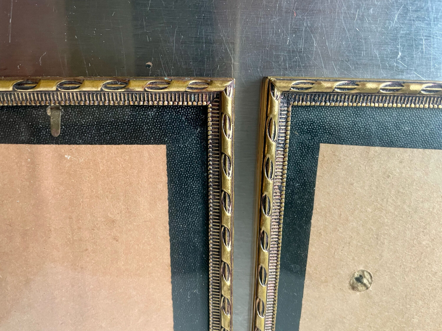 Pair of identical gold colored metal frames each measures  14.5 cm x 9 cm convex glass