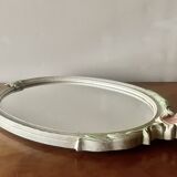 Vintage oval mirror in carved wood in pastel tones