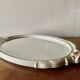 Vintage oval mirror in carved wood in pastel tones