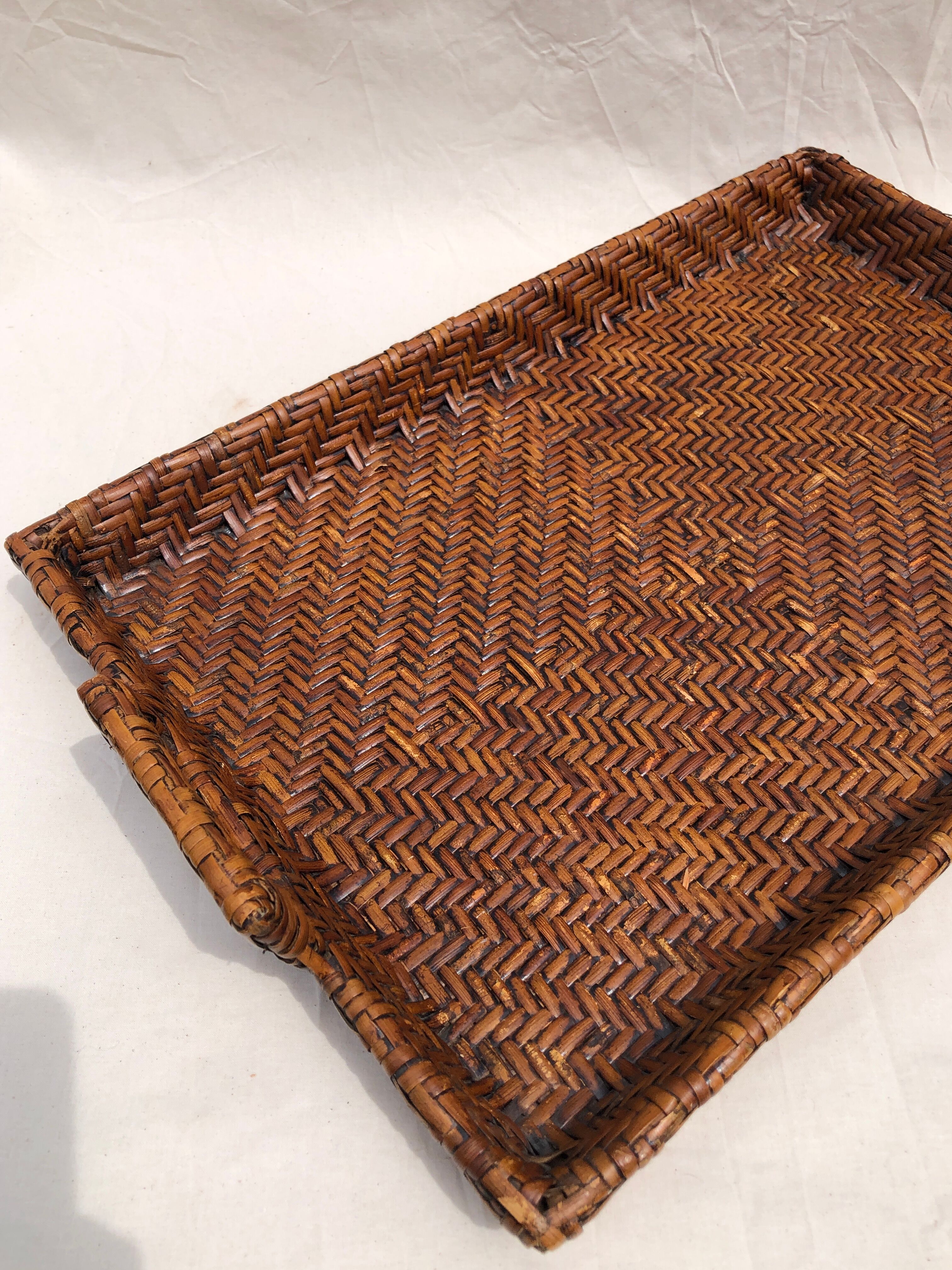 Pair of dark rattan trays