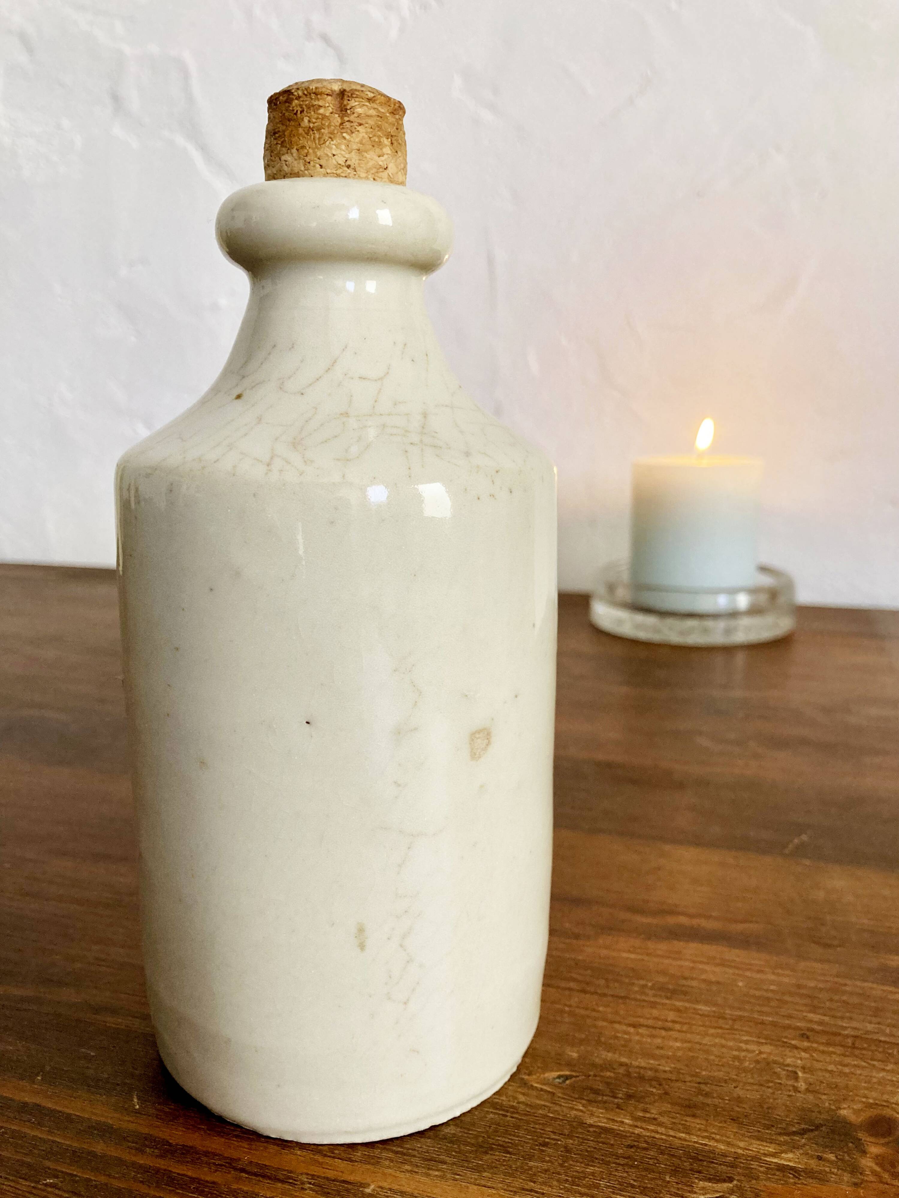 Trio of creamy white glazed stoneware bottles