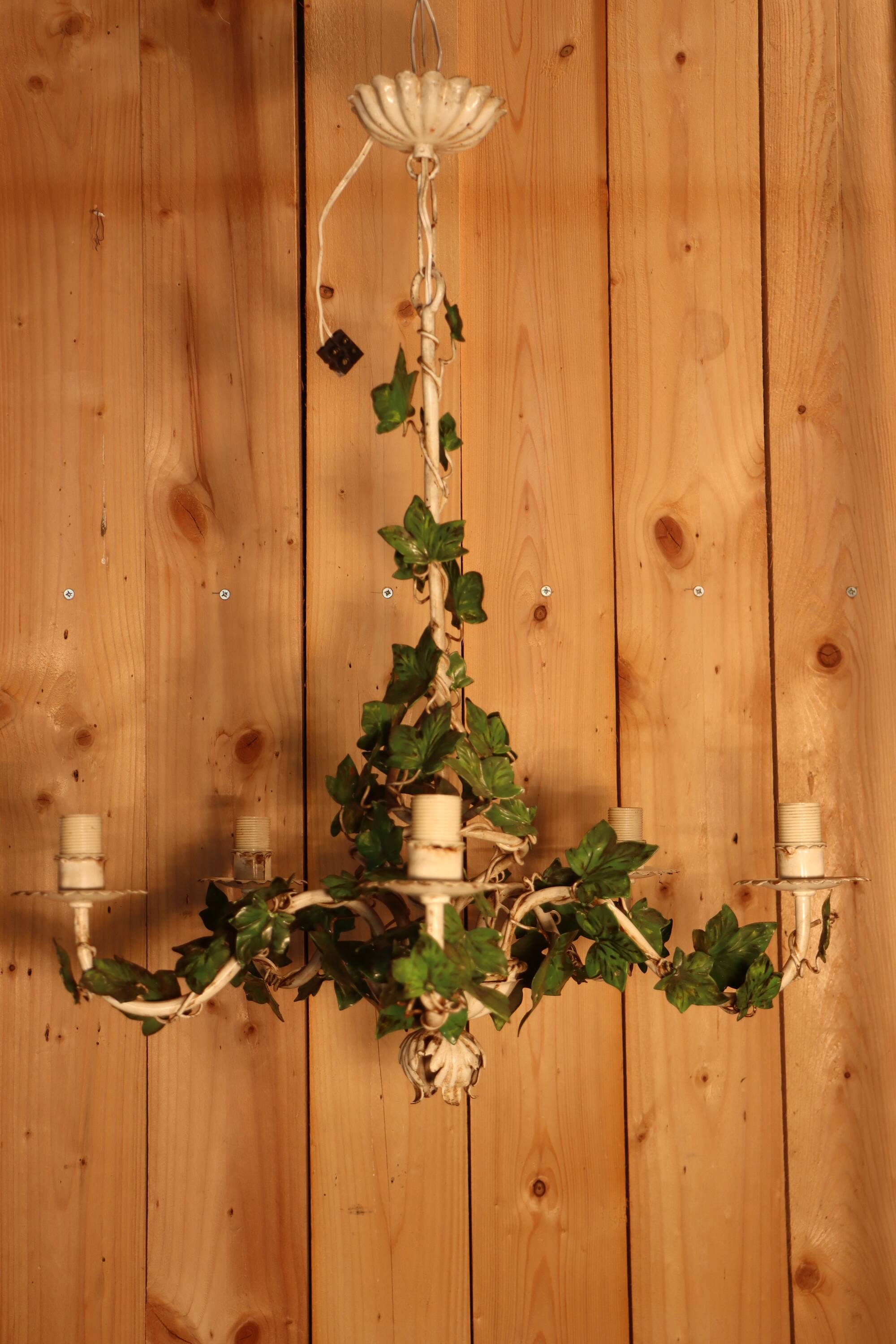 Antique metal chandelier with Art Nouveau floral decoration