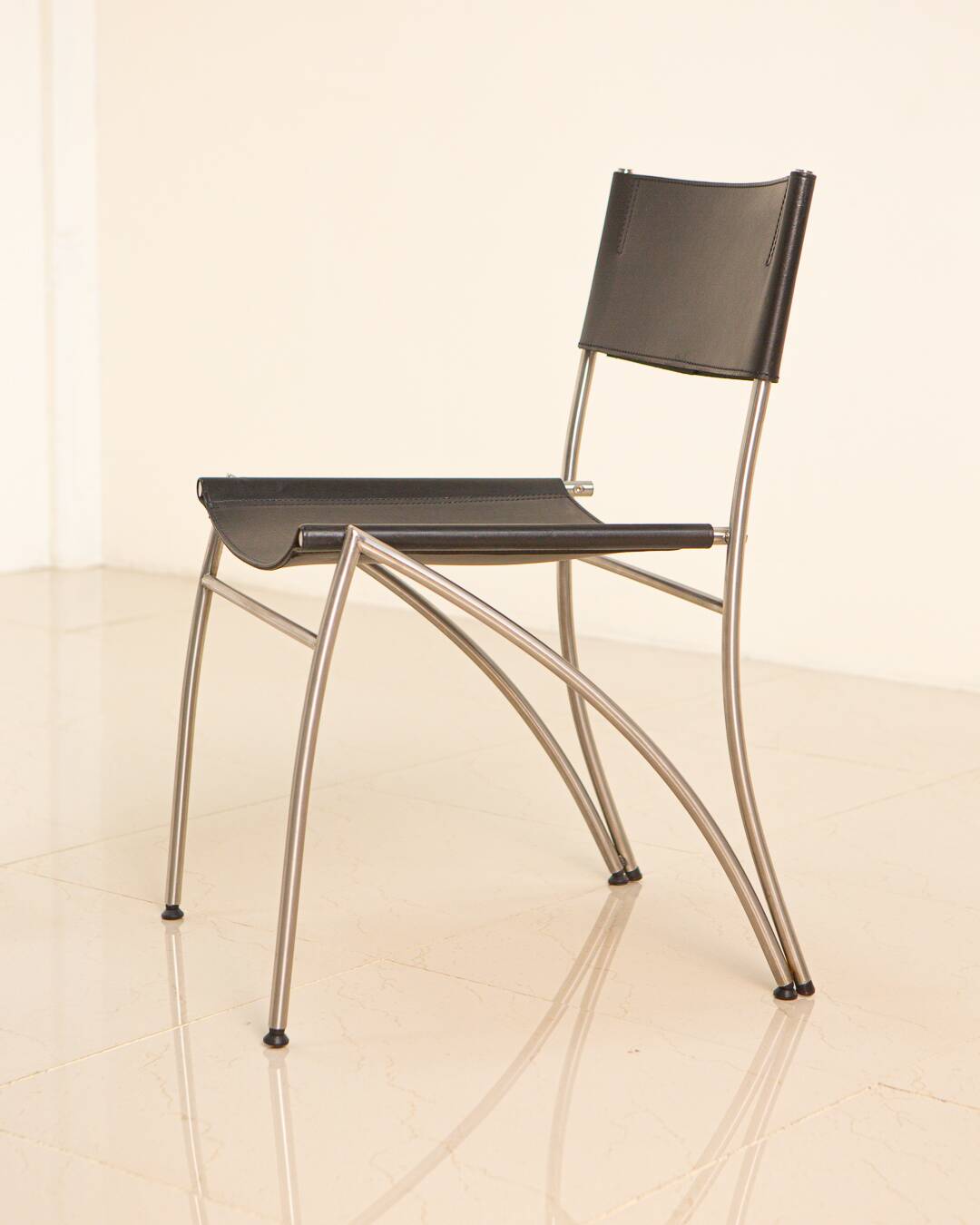 4 Italian black leather chairs from the 80s