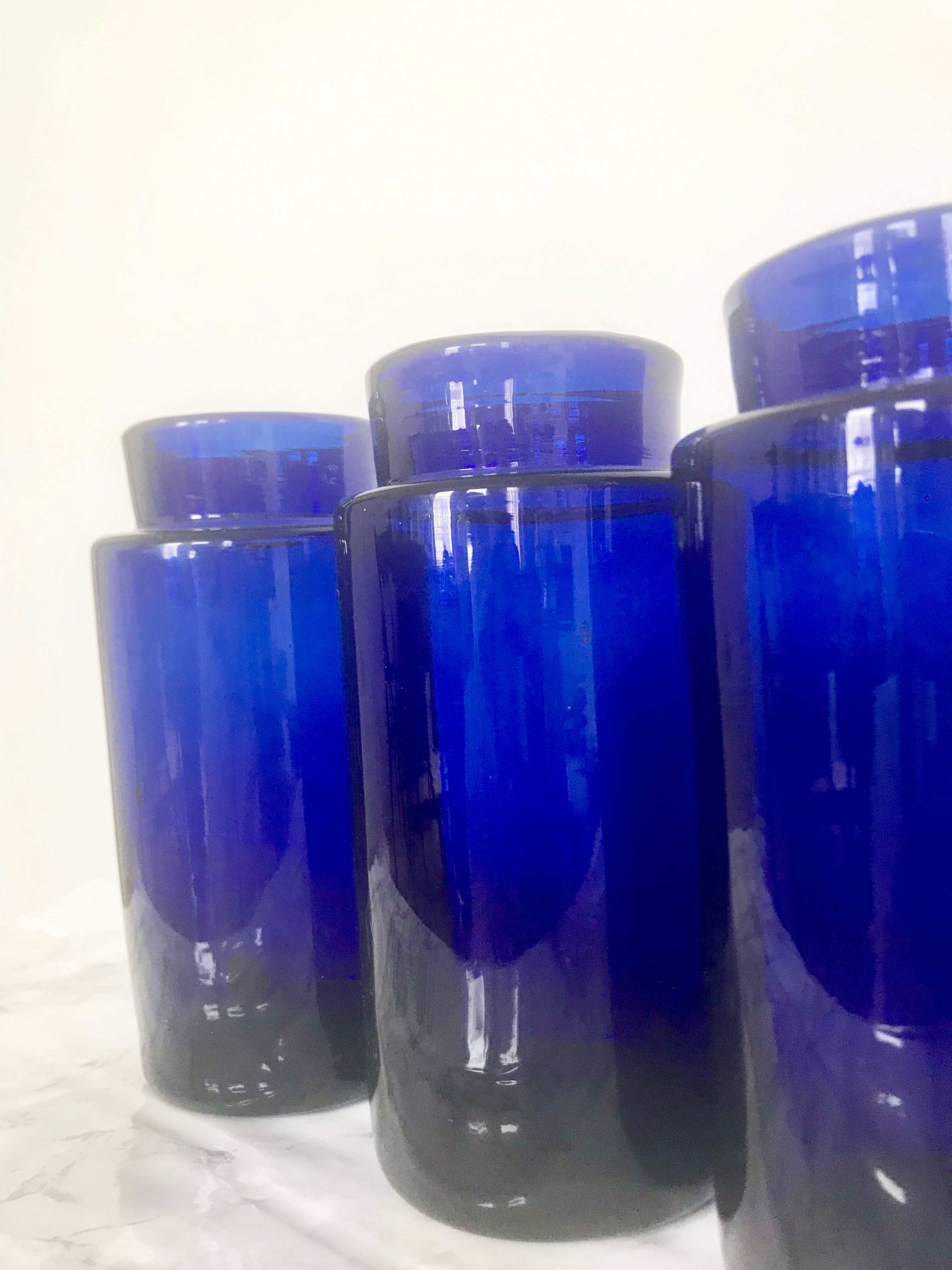 Suite of four bottles of ancient apothecary in blue breath glass
