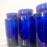 Suite of four bottles of ancient apothecary in blue breath glass