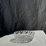 Circular glass ashtray with stylized petal patterns