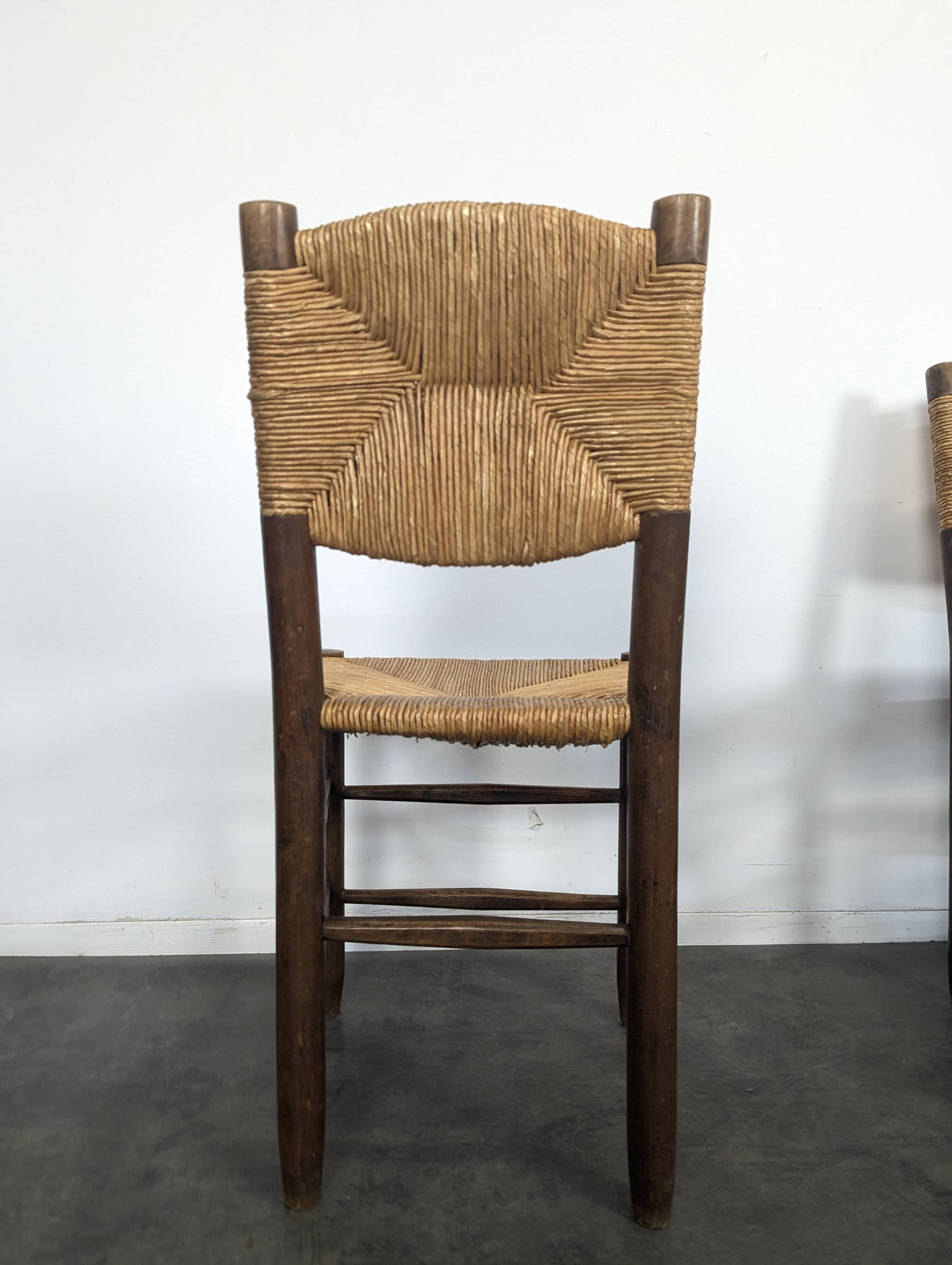 Série de 10 chaises modèle Bauche par Charlotte Perriand, circa 1960