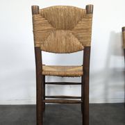 Set of 10 Bauche model chairs by Charlotte Perriand, circa 1960.