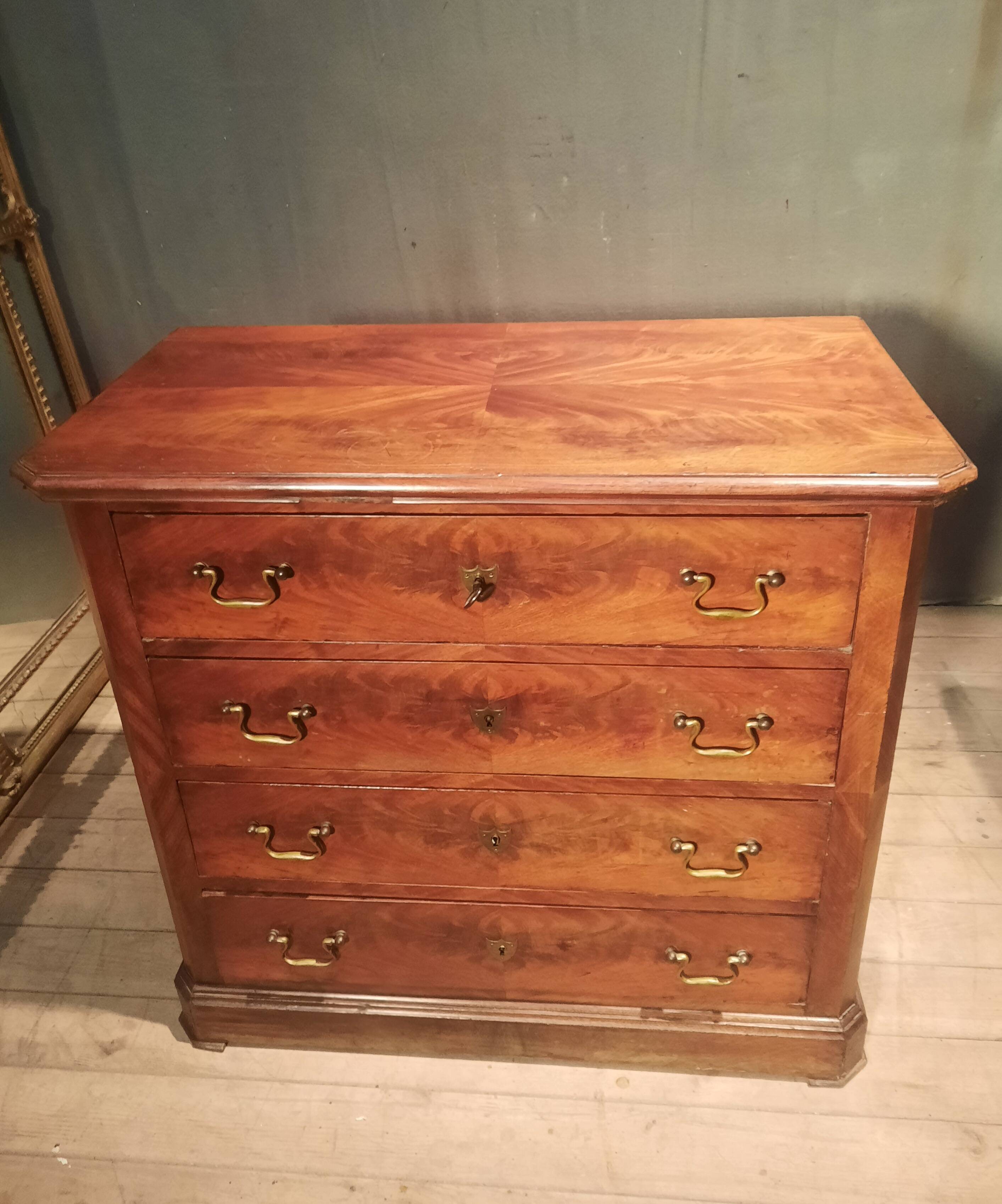 Small Louis Philippe chest of drawers with cut corners.