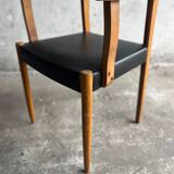 Set of 2 vintage beech wood armchairs with black skai upholstery — mid-century modern