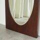 Faceted oval mirror with rectangular oak frame from the 1920s.