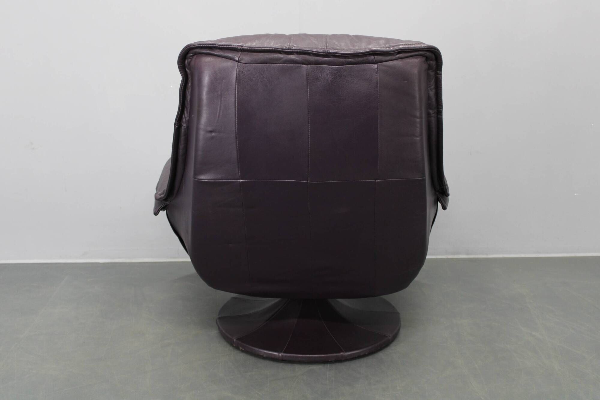 Italian dark purple leather swivel lounge chair, 1980s