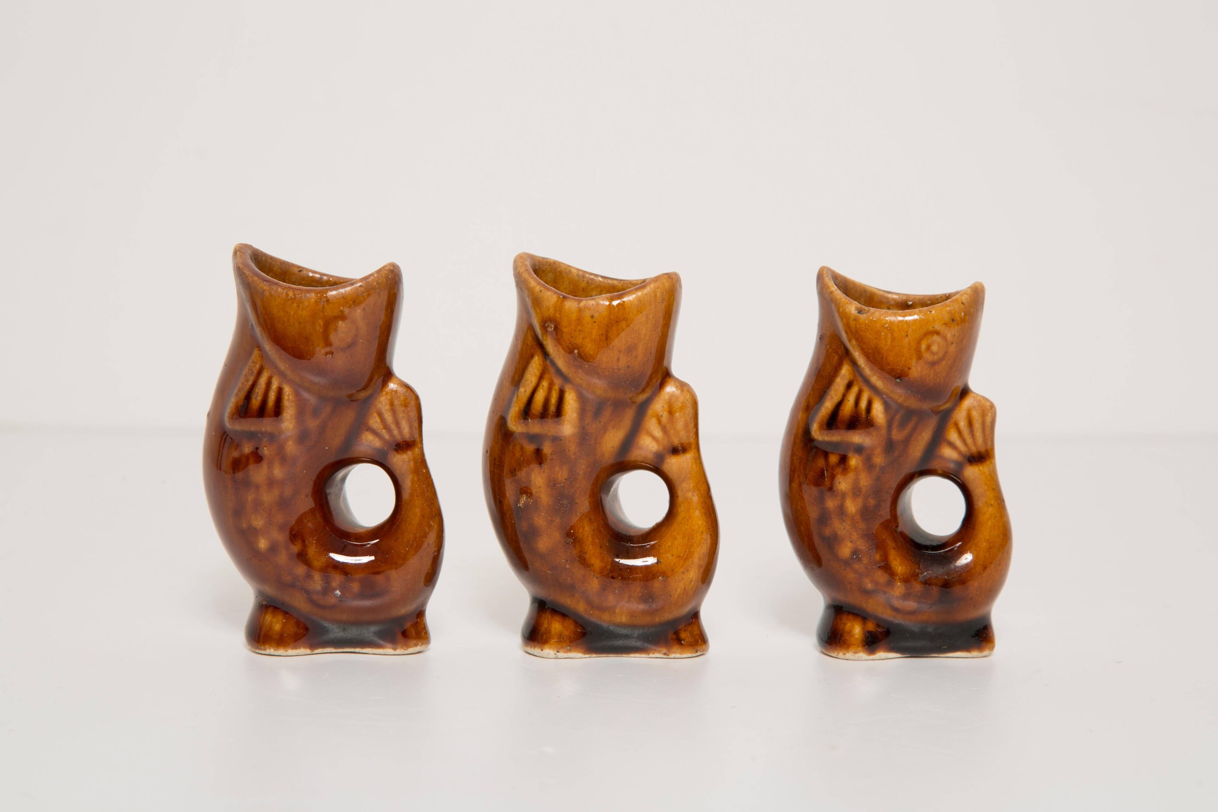 Set of three small brown glass fish, 20th century, Europe, 1960s