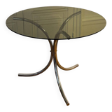 Table ronde en verre fumé et piètement central en inox