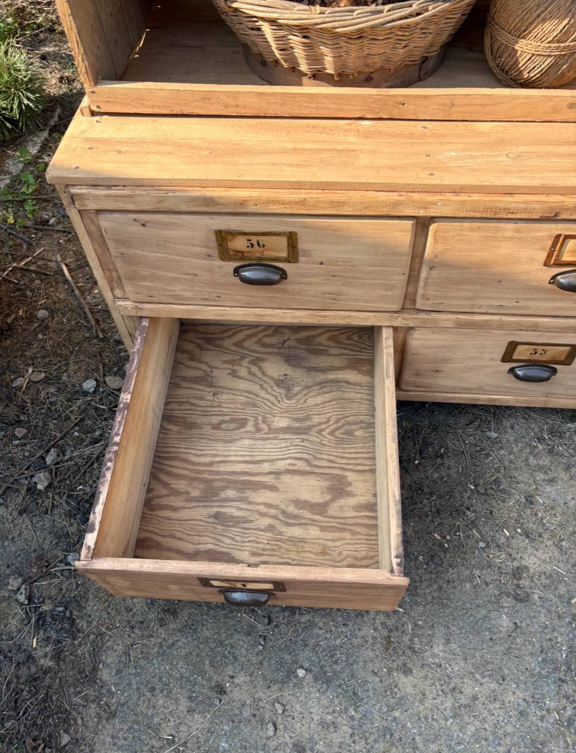 Large antique workshop furniture with drawers and shelves.
