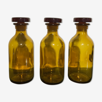 3 amber pharmacy jars